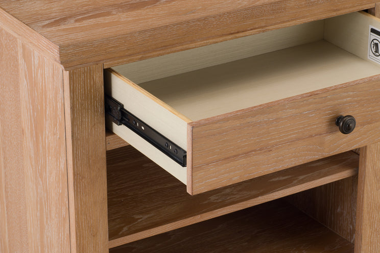 Wooden drawer being pulled out from a wooden cabinet.